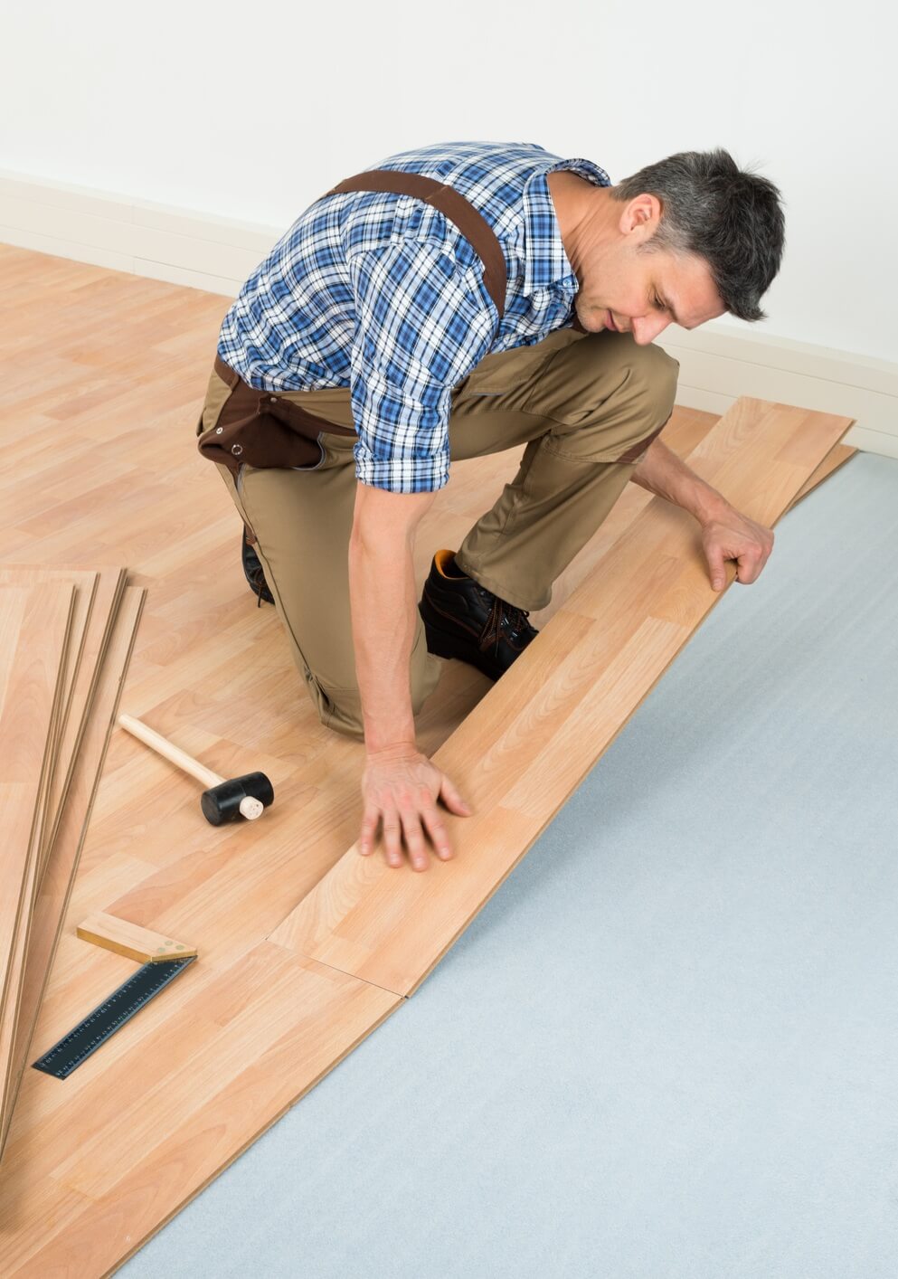 Man installing laminate