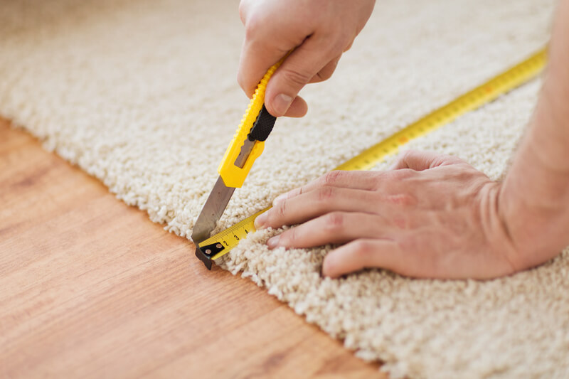 Measuring and cutting carpet
